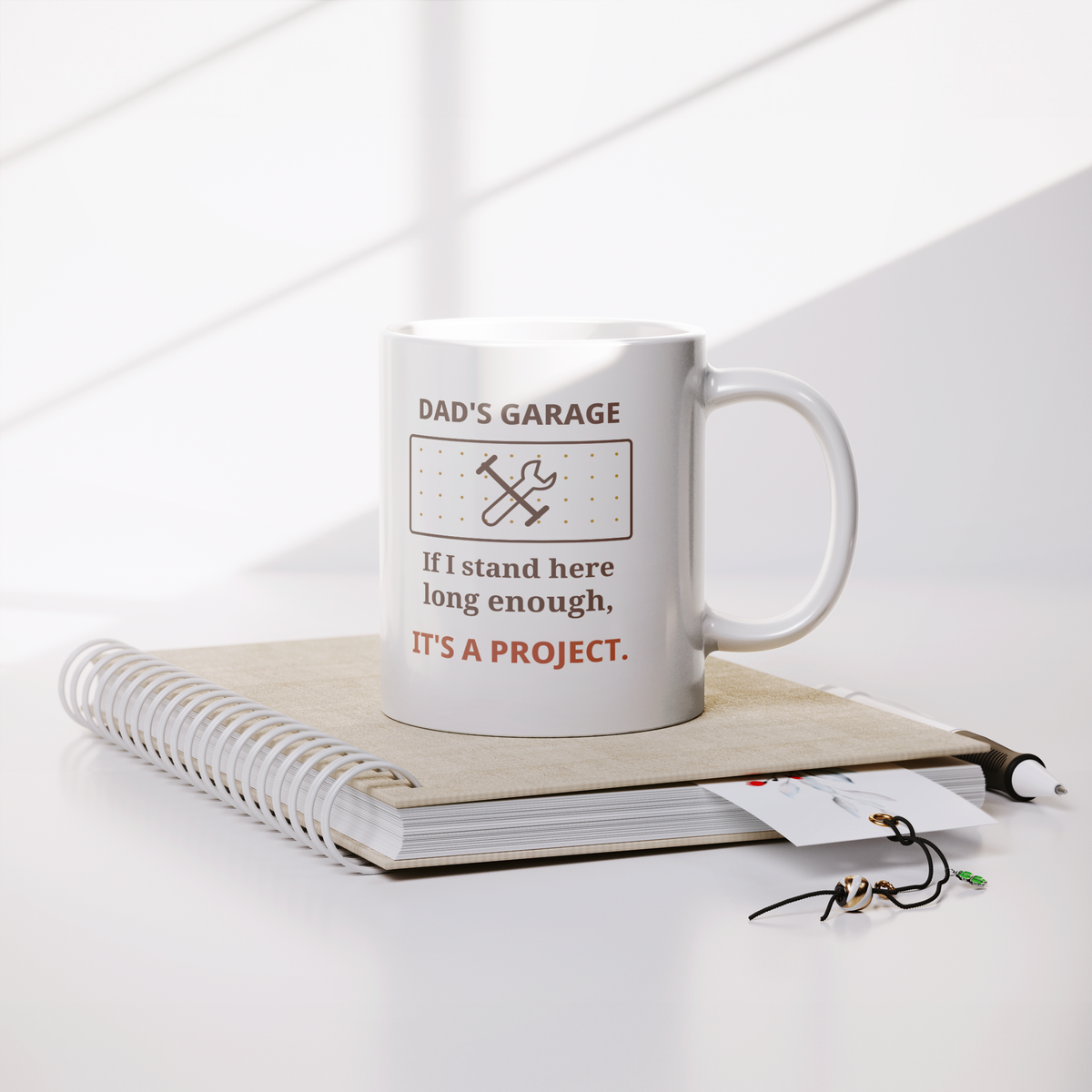 Dads_Garage_Project_Funny_Dad_Mug__Lifestyle_Notebook_Mockup.png_16216489