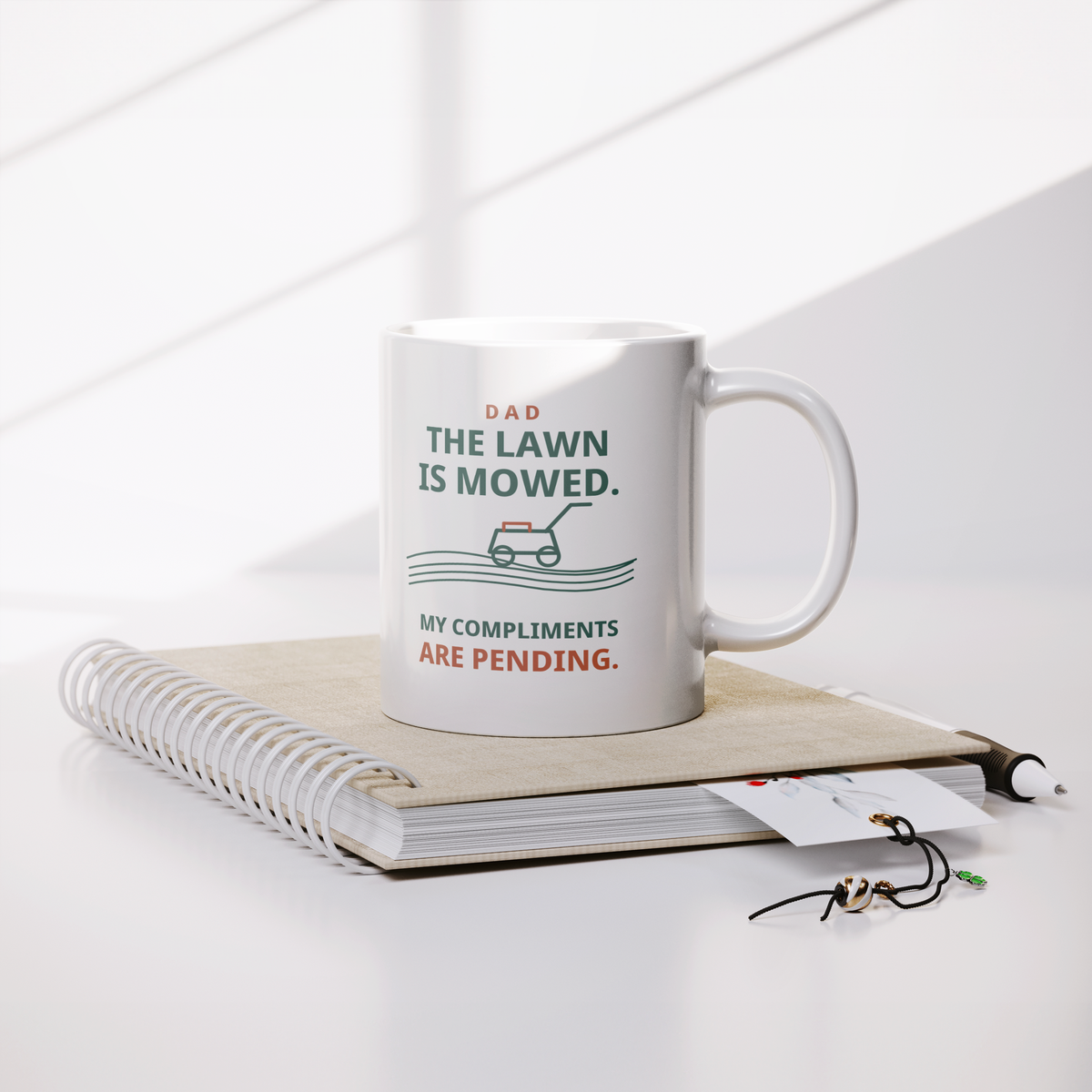 The_Lawn_Is_Mowed_Funny_Dad_Mug__Whit_Lifestyle_Notebook_Mockup.png_16216102