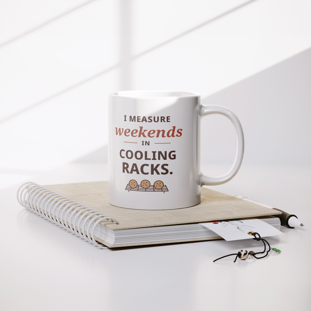 Weekends_in_Cooling_Racks_Mug_-_Home_Bak_Lifestyle_Notebook_Mockup.png_16215206