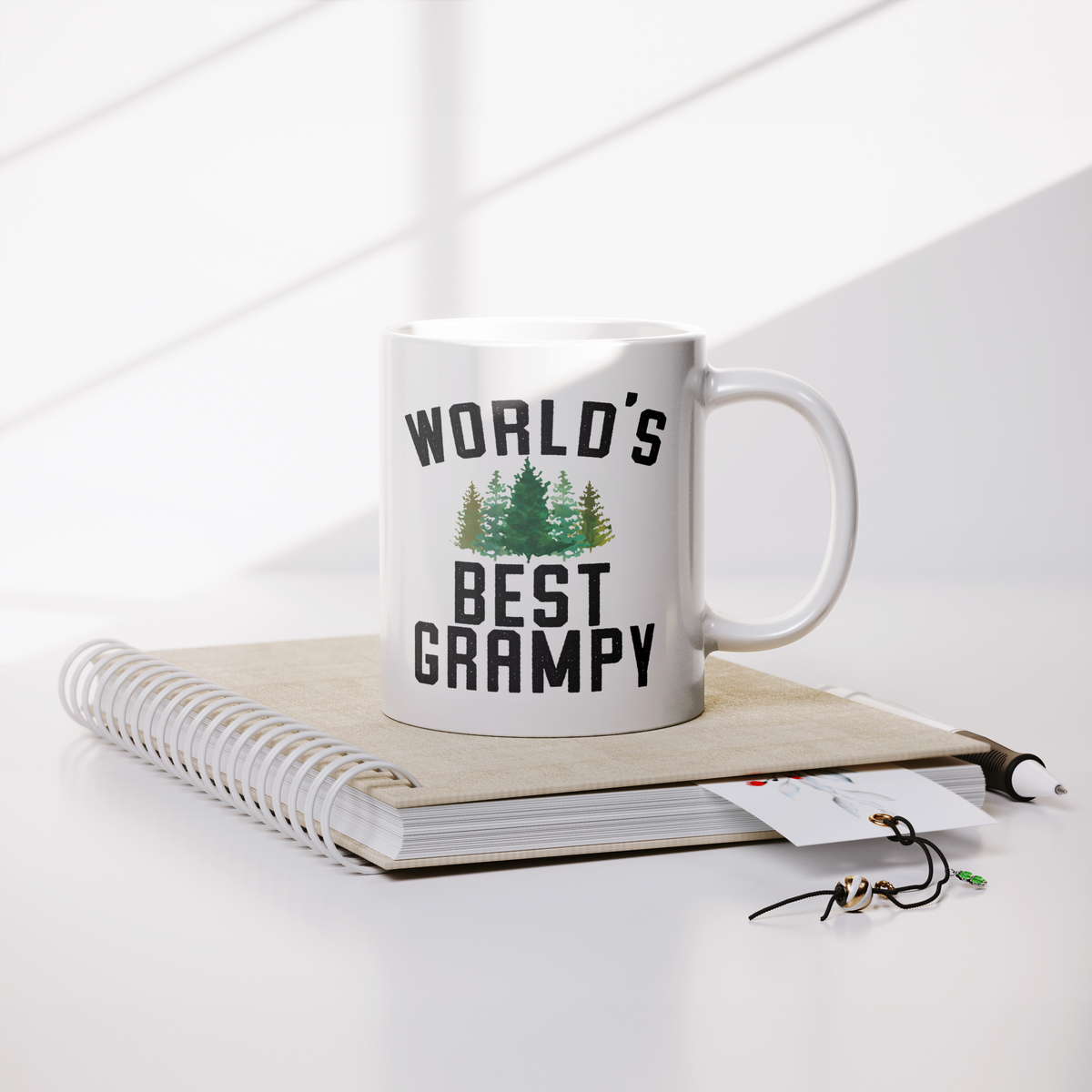 Worlds_Best_Grampy_Forest_Coffee_Mug_Lifestyle_Notebook_Mockup.png_13295226