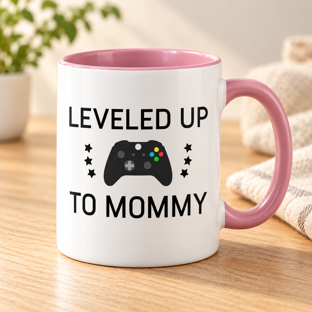Leveled Up To Mommy 11 oz ceramic mug, pink handle and interior, controller graphic