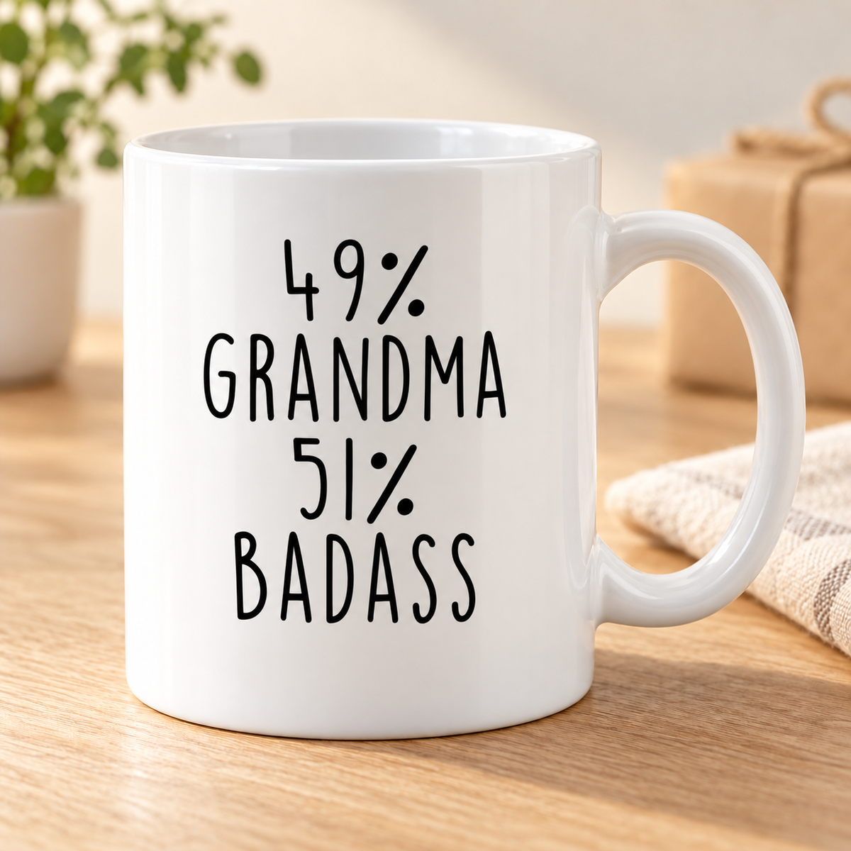 Gifts for Grandma 49% Grandma 51% Badass Coffee Mug — mug on a sunlit oak table