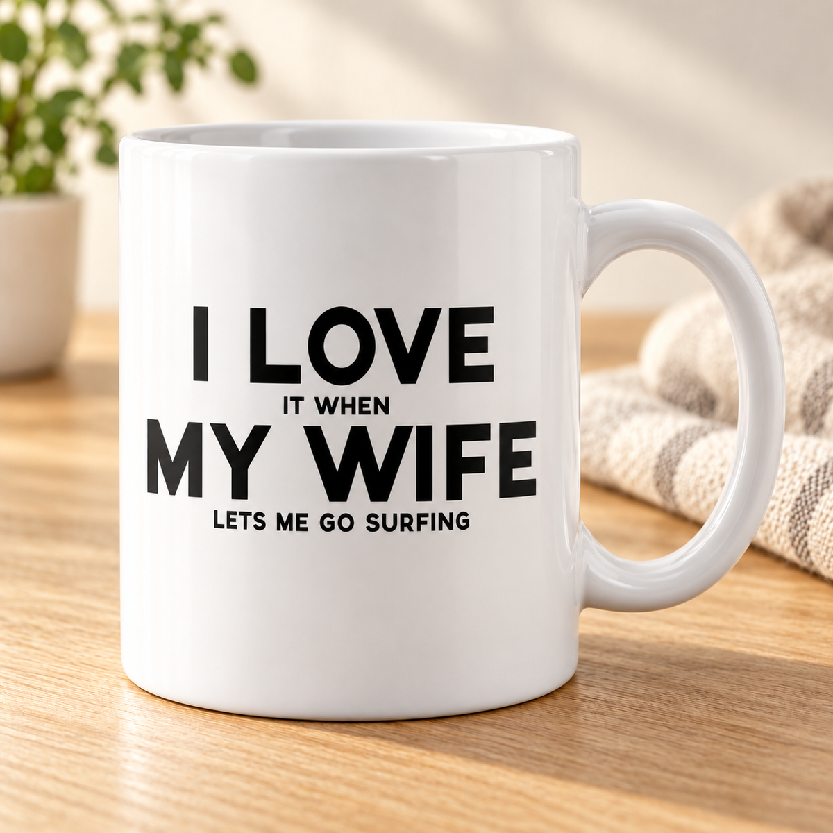 I Love It When My Wife Lets Me Go Surfing | Funny Husband Gift Coffee Mug — mug on a sunlit oak table