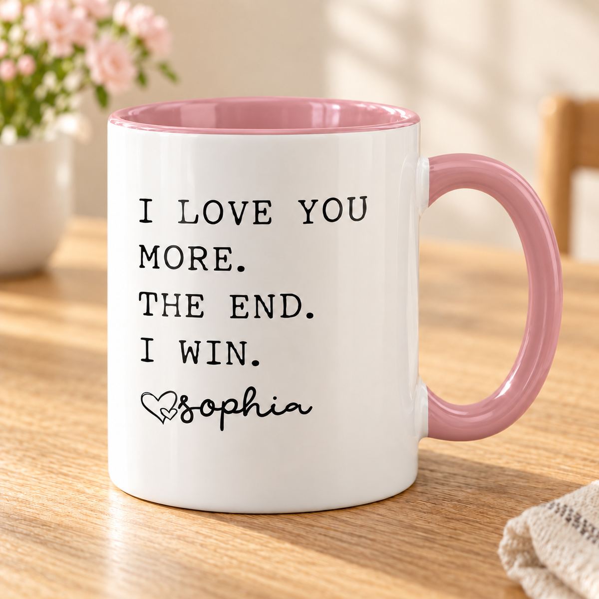 I Love You More Personalized Mug for Mom — Pink mug on a sunlit oak table