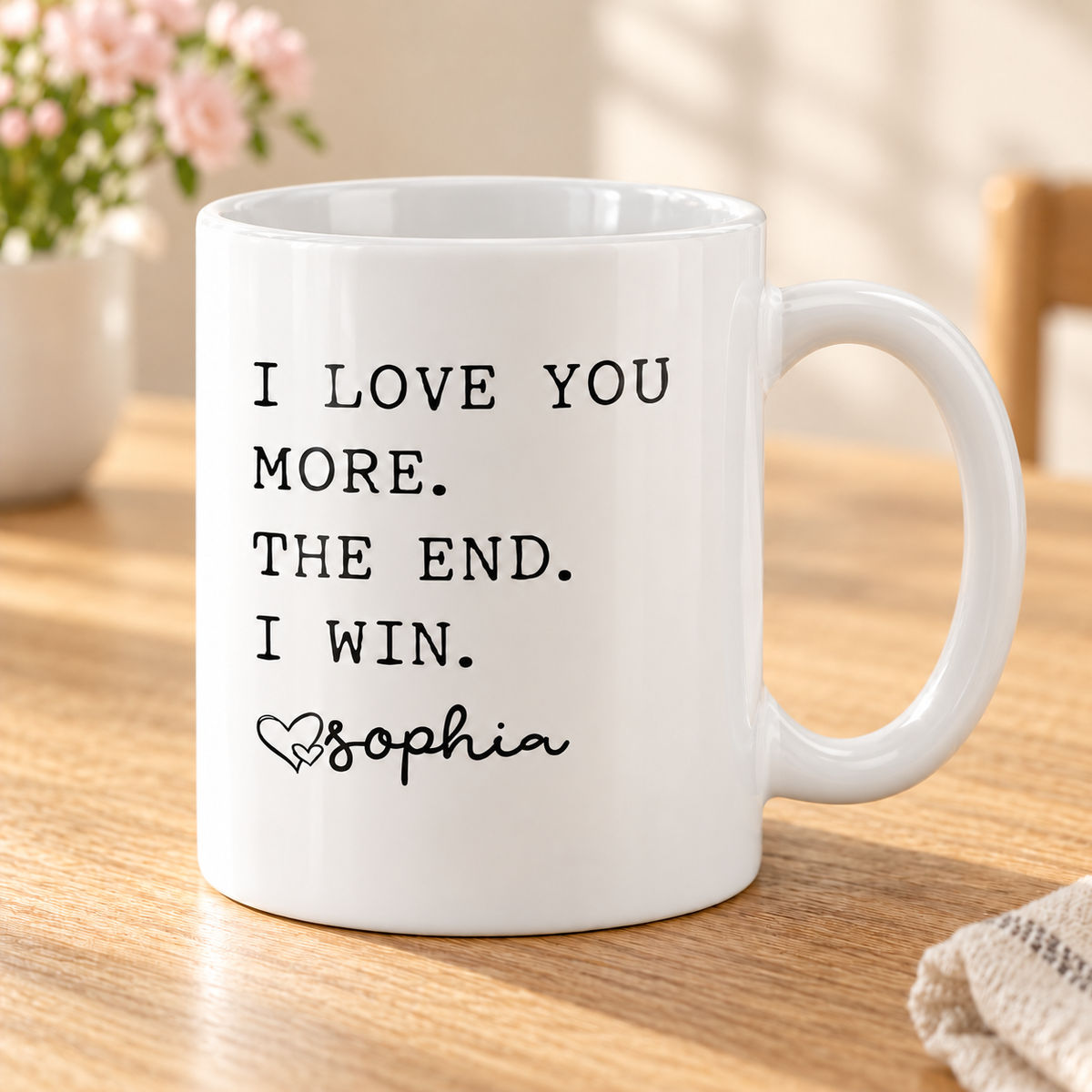 I Love You More Personalized Mug for Mom — White mug on a sunlit oak table