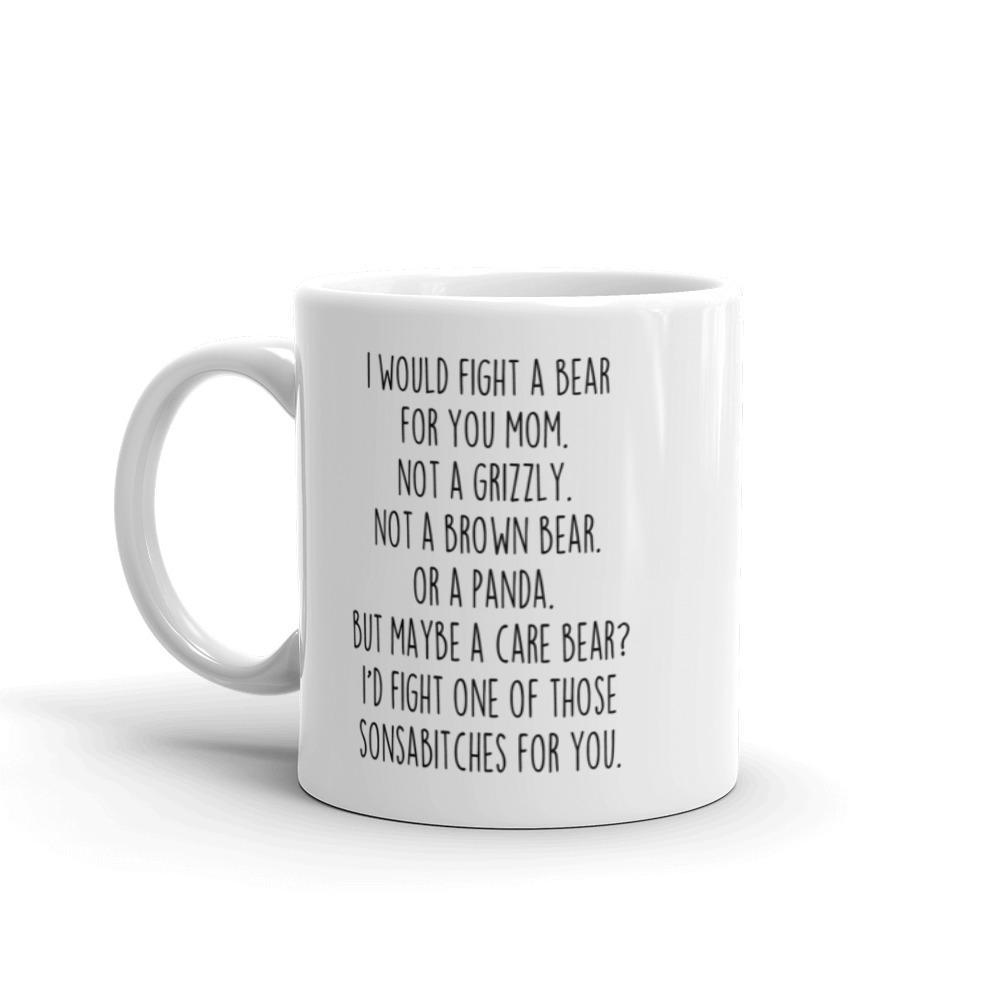 Angled view of the white "I Would Fight a Bear for You Mom" mug with its handle on the left