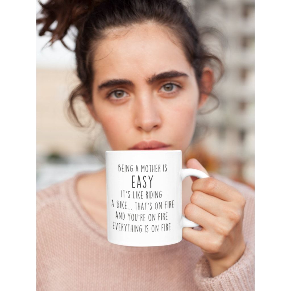Being A Mother Is Easy. Its Like Riding A Bike... Thats On Fire. And Your On Fire. Everything Is On Fire Coffee Mug $14.99 | Drinkware