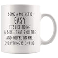 Being A Mother Is Easy. It's Like Riding A Bike... That's On Fire. And Your On Fire. Everything Is On Fire Coffee Mug - BackyardPeaks