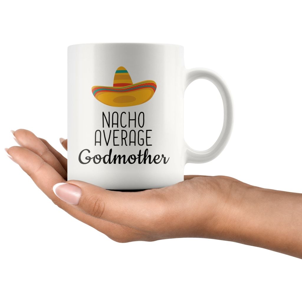 Nacho Average Godmother white mug resting on an open hand