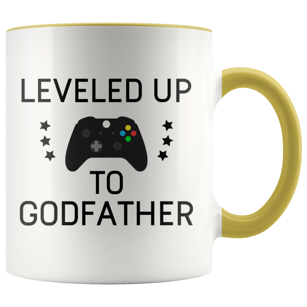 White mug with yellow handle and rim, "Leveled Up to Godfather" lettering, a game controller and stars